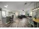 Bright, open-concept living area with hardwood floors and contemporary finishes throughout at 879 Lucky Ln, The Villages, FL 32162