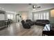Spacious living room with abundant natural light, hardwood floors and cozy furniture at 879 Lucky Ln, The Villages, FL 32162