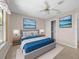 Cozy bedroom featuring a serene color scheme, decorative pictures, and ample closet space at 1061 Soledad Way, The Villages, FL 32159
