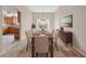 Formal dining room with a large table, chandelier, and scenic artwork, perfect for Gathering gatherings at 1061 Soledad Way, The Villages, FL 32159