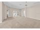 Expansive living area with neutral tones, ample space, and an open layout, perfect for entertaining guests at 1061 Soledad Way, The Villages, FL 32159