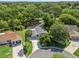 Aerial view of a well-maintained property with mature landscaping and a screened lanai at 1105 Del Toro Dr, The Villages, FL 32159