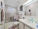 Well-lit bathroom with a shower-tub combo and a white vanity at 1105 Del Toro Dr, The Villages, FL 32159