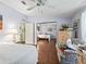 Bright bedroom with a mirrored closet and open bathroom entrance at 1105 Del Toro Dr, The Villages, FL 32159