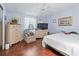 Cozy bedroom with hardwood floors, light purple walls, and ample closet space at 1105 Del Toro Dr, The Villages, FL 32159