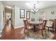 Cozy dining room featuring hardwood floors, skylight, chandelier, and modern design at 1105 Del Toro Dr, The Villages, FL 32159