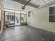 Clean garage with an open door that leads to a patio at 1105 Del Toro Dr, The Villages, FL 32159