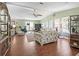 Bright living room featuring hardwood floors, vaulted ceilings, and lots of natural light at 1105 Del Toro Dr, The Villages, FL 32159