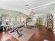 Open living room featuring hardwood floors, vaulted ceilings, and lots of space for furniture at 1105 Del Toro Dr, The Villages, FL 32159