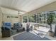 Relaxing screened-in patio with outdoor furniture and serene views at 1105 Del Toro Dr, The Villages, FL 32159