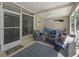 Cozy screened-in patio with comfortable furniture and an open view at 1105 Del Toro Dr, The Villages, FL 32159