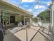 Spacious screened-in patio perfect for entertaining, featuring lounge chairs and comfortable seating area at 1105 Del Toro Dr, The Villages, FL 32159