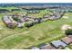 Aerial view of homes along a golf course in a well-maintained community at 11702 Se 173Rd Lane Rd, Summerfield, FL 34491