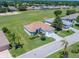 An aerial view of a home with beautiful landscaping and a golf course view at 11702 Se 173Rd Lane Rd, Summerfield, FL 34491