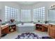 This bright bathroom features unique glass block windows and custom vanities at 11702 Se 173Rd Lane Rd, Summerfield, FL 34491