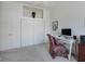 Bright bedroom with a closet, a desk with computer, and a patterned chair at 11702 Se 173Rd Lane Rd, Summerfield, FL 34491