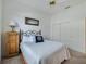 This cozy bedroom has a large window, closet, and bedside cabinet at 11702 Se 173Rd Lane Rd, Summerfield, FL 34491