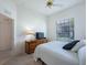 This cozy bedroom features a television, closet and large bright window at 11702 Se 173Rd Lane Rd, Summerfield, FL 34491