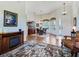 Open concept dining area with hardwood floors, stylish lighting, and an elegant table setting at 11702 Se 173Rd Lane Rd, Summerfield, FL 34491