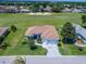 Charming home with a well-maintained lawn, landscaping and a view of the golf course at 11702 Se 173Rd Lane Rd, Summerfield, FL 34491