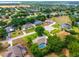 Aerial view of a residential neighborhood with lush trees and well-maintained homes at 11811 Ridge View Cir, Clermont, FL 34711