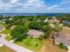 An aerial showcases a well-manicured lawn and landscaped yard near a lake community at 11811 Ridge View Cir, Clermont, FL 34711