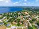 Aerial view highlighting the home's location near a picturesque lake, surrounded by lush greenery at 11811 Ridge View Cir, Clermont, FL 34711