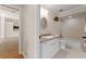 Bathroom with a tub-shower combo, a single vanity, and an oval mirror at 11811 Ridge View Cir, Clermont, FL 34711