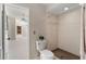 This bathroom offers a toilet and a walk-in shower with tiled walls at 11811 Ridge View Cir, Clermont, FL 34711
