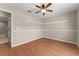 Bright bedroom with hardwood floors and a ceiling fan at 11811 Ridge View Cir, Clermont, FL 34711