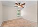 A bright bedroom is illuminated with natural light and a ceiling fan at 11811 Ridge View Cir, Clermont, FL 34711