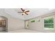 Bedroom featuring a tray ceiling and natural light at 11811 Ridge View Cir, Clermont, FL 34711