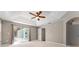 Bedroom that offers pool access, tile floors and tray ceiling at 11811 Ridge View Cir, Clermont, FL 34711