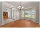 The dining room features wood floors, an elegant chandelier, and a bay window at 11811 Ridge View Cir, Clermont, FL 34711