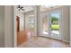 A foyer boasts tile entry, a transom window, and a clear view to the front yard at 11811 Ridge View Cir, Clermont, FL 34711