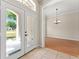 A bright foyer with tile flooring offers views into an adjacent dining room at 11811 Ridge View Cir, Clermont, FL 34711