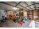 View of a spacious garage with shelving, tools, and ample storage space at 11811 Ridge View Cir, Clermont, FL 34711