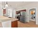 A well-equipped kitchen features stainless steel appliances and access to the laundry room at 11811 Ridge View Cir, Clermont, FL 34711