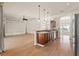 A modern kitchen with warm wood cabinets opens to a spacious living area at 11811 Ridge View Cir, Clermont, FL 34711