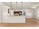 Modern kitchen with stainless steel appliances and bar-top seating at 11811 Ridge View Cir, Clermont, FL 34711
