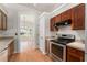 The kitchen is equipped with stainless steel appliances and wooden cabinets at 11811 Ridge View Cir, Clermont, FL 34711