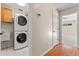 Practical laundry room with stackable washer and dryer at 11811 Ridge View Cir, Clermont, FL 34711