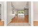 A bright and airy living room featuring wood flooring and a sliding glass door leading to the patio at 11811 Ridge View Cir, Clermont, FL 34711