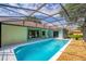 Backyard pool with lanai, ideal for enjoying sunny days and outdoor recreation at 11811 Ridge View Cir, Clermont, FL 34711