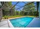 Enclosed pool area featuring a sparkling pool at 11811 Ridge View Cir, Clermont, FL 34711