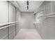 Walk-in closet with white shelving and track lighting at 11811 Ridge View Cir, Clermont, FL 34711