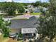 A tranquil neighborhood view highlights the backyard and screened lanai of this beautiful home at 1203 Zapata Pl, The Villages, FL 32159