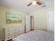 Bright bedroom with hardwood floors, ample closet space, and contemporary decor at 1203 Zapata Pl, The Villages, FL 32159