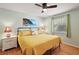 Comfortable bedroom featuring a cozy bed with decorative pillows and natural light at 1203 Zapata Pl, The Villages, FL 32159