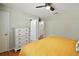 Bedroom with a view to en-suite bathroom, light-filled, and inviting design at 1203 Zapata Pl, The Villages, FL 32159